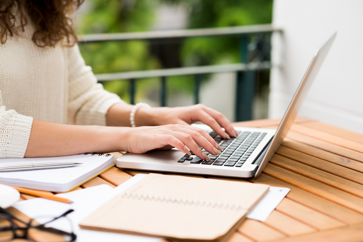 woman typing on laptop